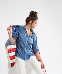 Bent Oaks Boutique This three quarter sleeve, cotton shirt has a woven garment dyed design to  imitate a denim shirt. Perfect for summer weather, this top is paired with white stretch pants.