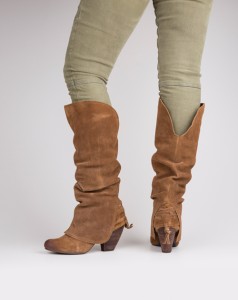 Beau Monde Boutique Make a trendy statement with these suede slouch boots. They feature a lace-up fringe accent at the heel and fold-over shaft with rounded toe.