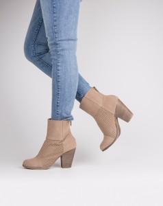 The Pelican District Strut it in these fashionable ankle booties that feature a faux suede material and zip up closure. The laser-cut details add a stylish finish to these cute kicks.